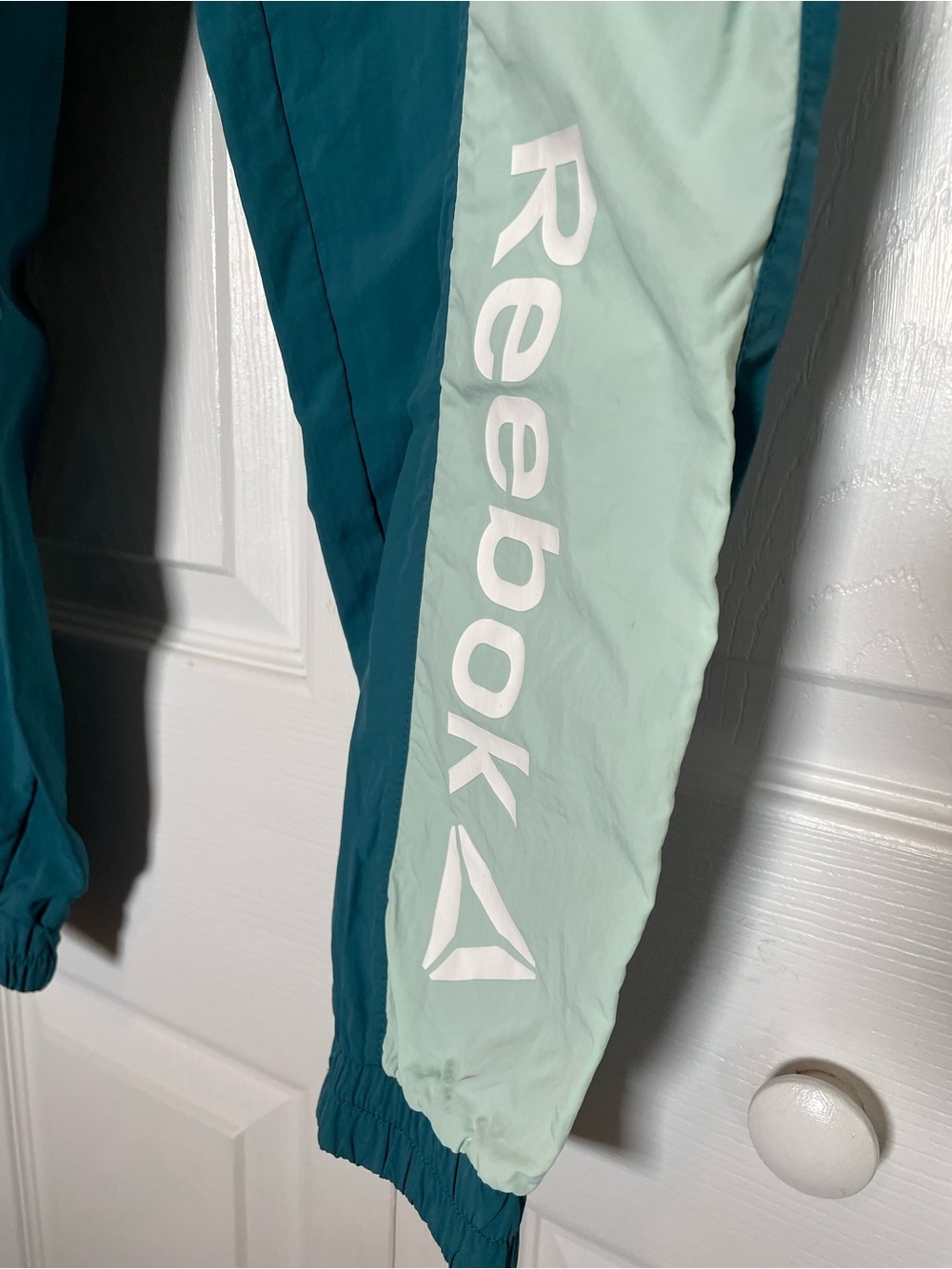 Reebok Women's M Focus Track Woven Pants teal/mint green "Dragonfly" colorway